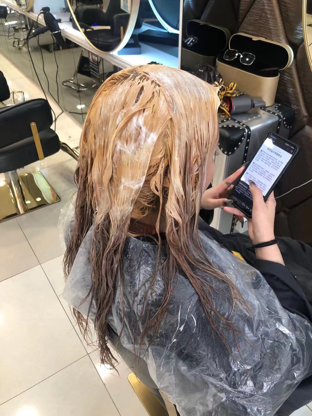 Colour being applied to a client's hair
